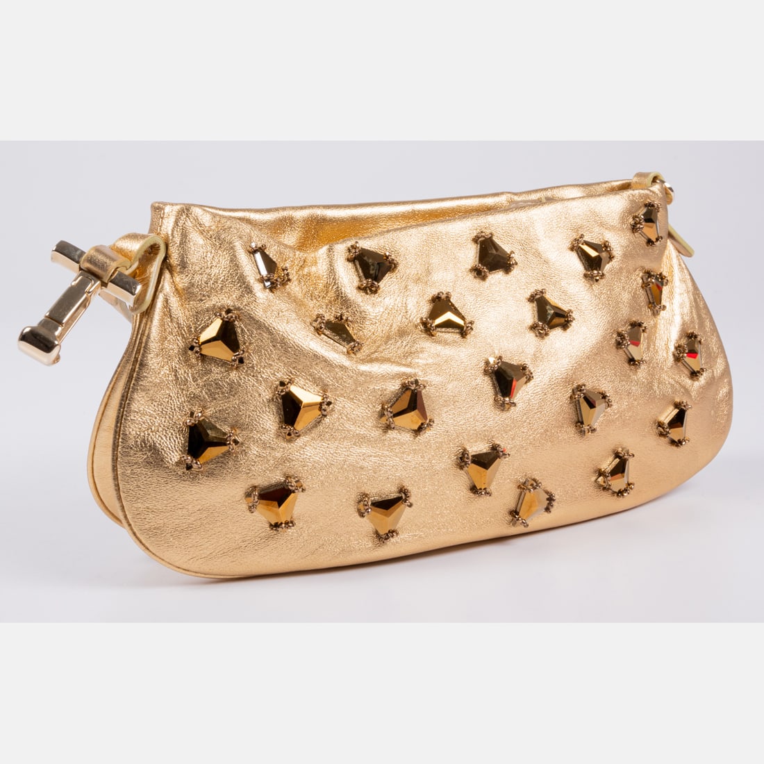 Tods Gold Leather Clutch: A Tods Gold Leather Clutch, Decorated on front and reverse with metallic beadwork. Zippered closure. Champagne colored satin lining. Wristlet strap with metal T-shaped locking hook. Measures H: 5 x W:
