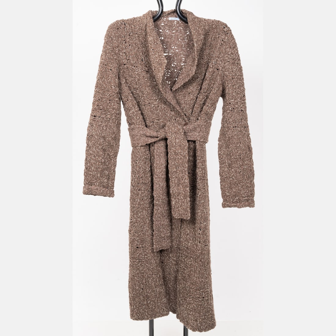 Malo Belted Sweater: A Light Brown Malo Belted Sweater, Size 46. 65% cashmere / 35% silk. Body of sweater consists of yarn woven into a pattern of spirals and rosettes. Flat measurements: Shoulders: 18 in. Sleeves: 24 in.