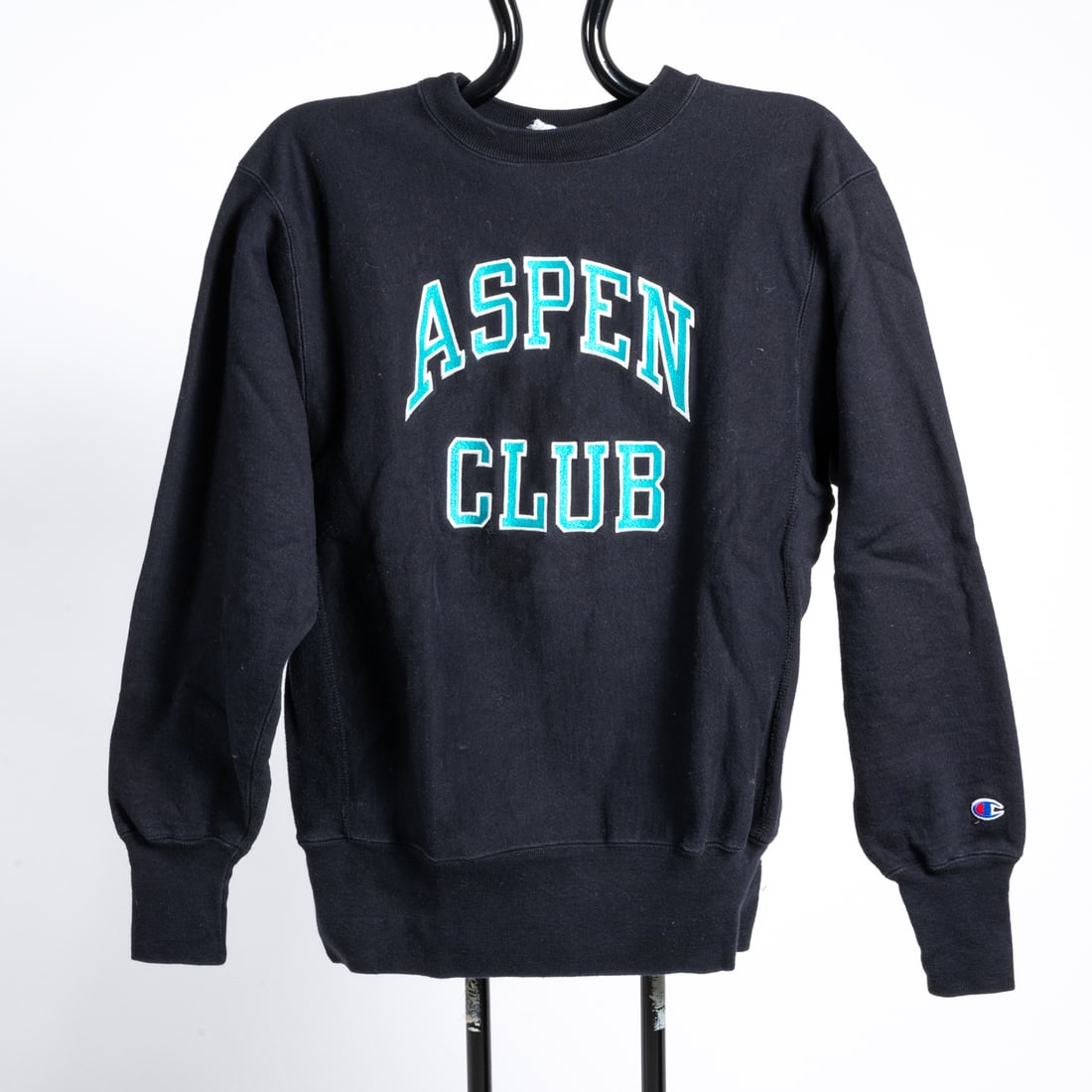 Vintage Aspen Club Sweatshirt: A Vintage Aspen Club Sweatshirt, Collegiate-style sweatshirt with turquoise and white embroidery. By Champion. 90% cotton / 10% polyester. Flat measurements: Shoulders: 19 in. Sleeves: 25 in. Length: 