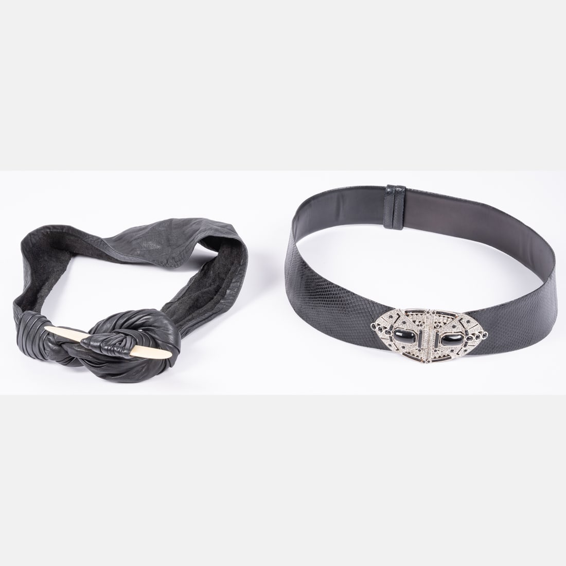 Judith Leiber Belt: A Judith Leiber Belt, An adjustable embossed leather belt by Judith Leiber, complete with a rhinestone and silvertone metal buckle. Belt measures 2 1/4 inches wide at widest point and can be expanded