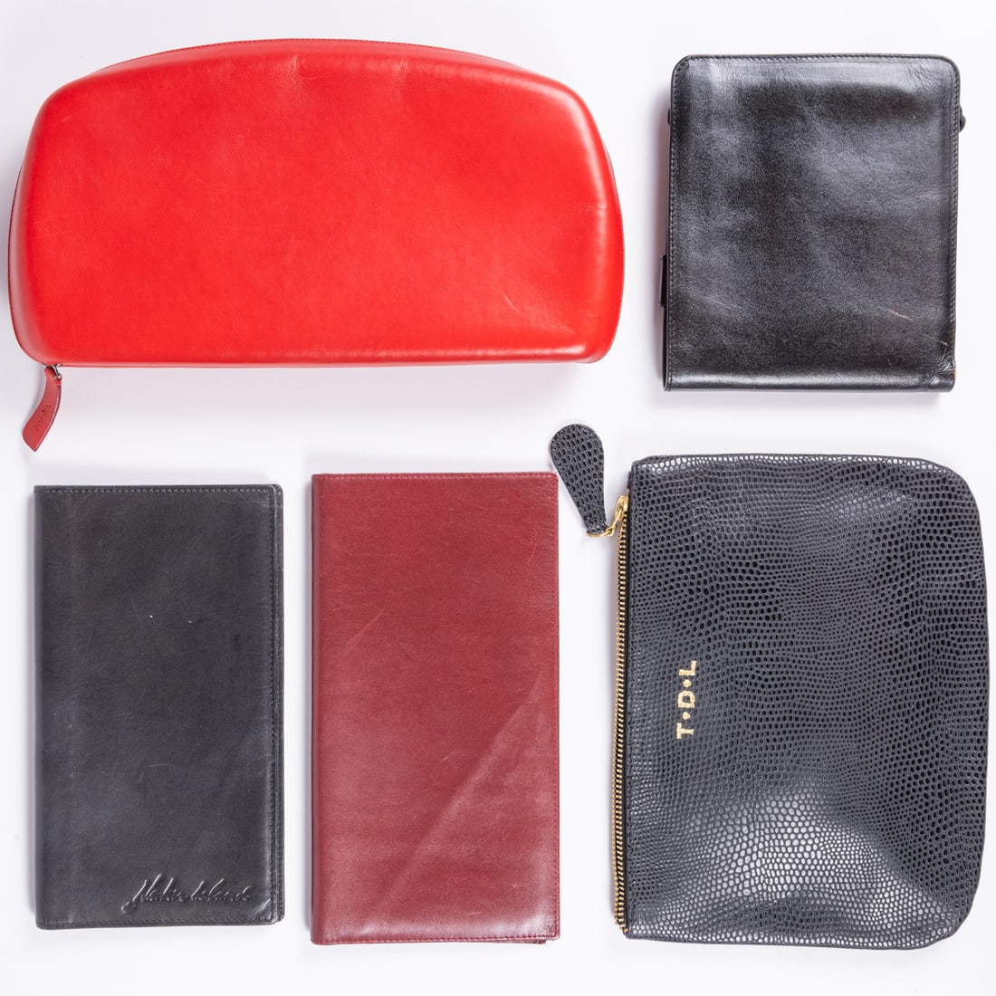 Five Leather Clutches And Billfolds: Five Leather Clutches, Pouches And Billfolds, The first, a red leather Malo clutch with zippered closure. Red and pale blue leather interior lining with numerous compartments and spaces for cards. One