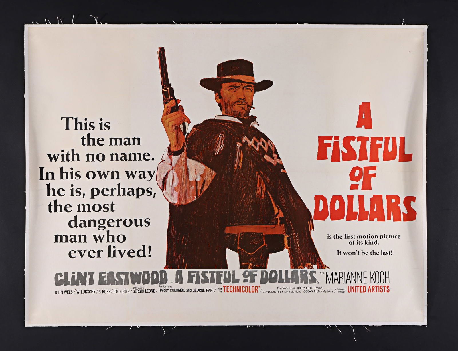 A FISTFUL OF DOLLARS (1964) - UK Quad - Linen Backed, 1967 (First Release): Based upon a concept design by Mitchell Hooks and finished artwork by David Blossom, this original 1967 UK Quad film poster for the classic Sergio Leone western A Fistful of Dollars set the tone and c