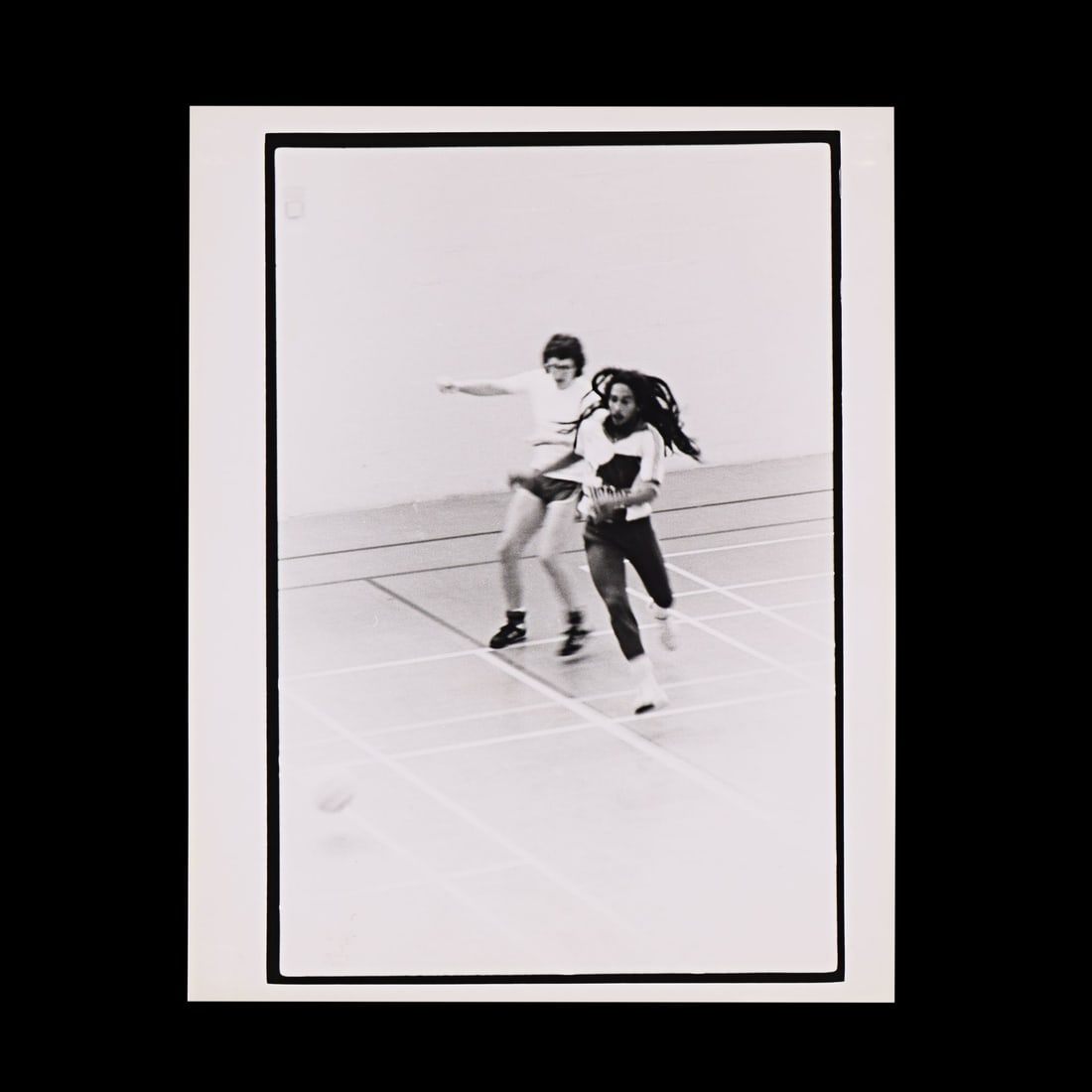 BOB MARLEY - The Rockarchive Collection: Bob Marley Playing Football Silver Gelatin Print by Richard: BOB MARLEY - The Rockarchive Collection: Bob Marley Playing Football Silver Gelatin Print by Richard Mann, London, 1979 - A silver gelatin photographic print of Bob Marley taken by photographer Richar