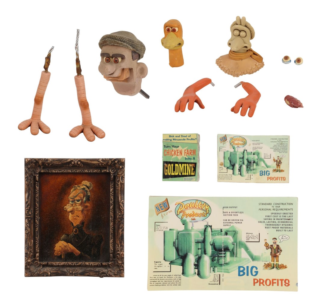 CHICKEN RUN (2000) - Production-Used Rocky Head, Character Components, In Town Sign, and Mr and Mrs: CHICKEN RUN (2000) - Production-Used Rocky Head, Character Components, In Town Sign, and Mr and Mrs Tweedy Components - A production-used Rocky head, character pieces, set dressings and behind the sce