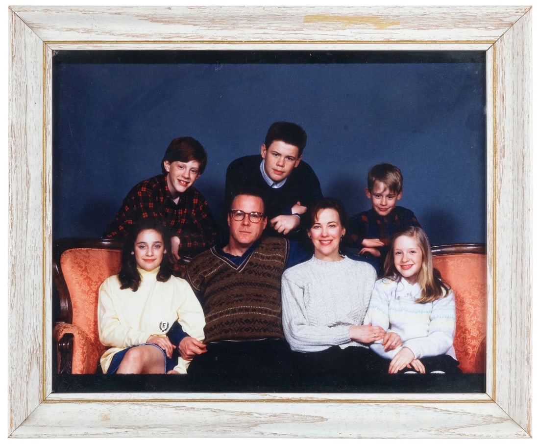 HOME ALONE (1990) - Framed Production-Made McAllister Family Photograph: HOME ALONE (1990) - Framed Production-Made McAllister Family Photograph - A framed photograph of the McAllister family from the production of Chris Columbus' Home Alone. After they accidentally left