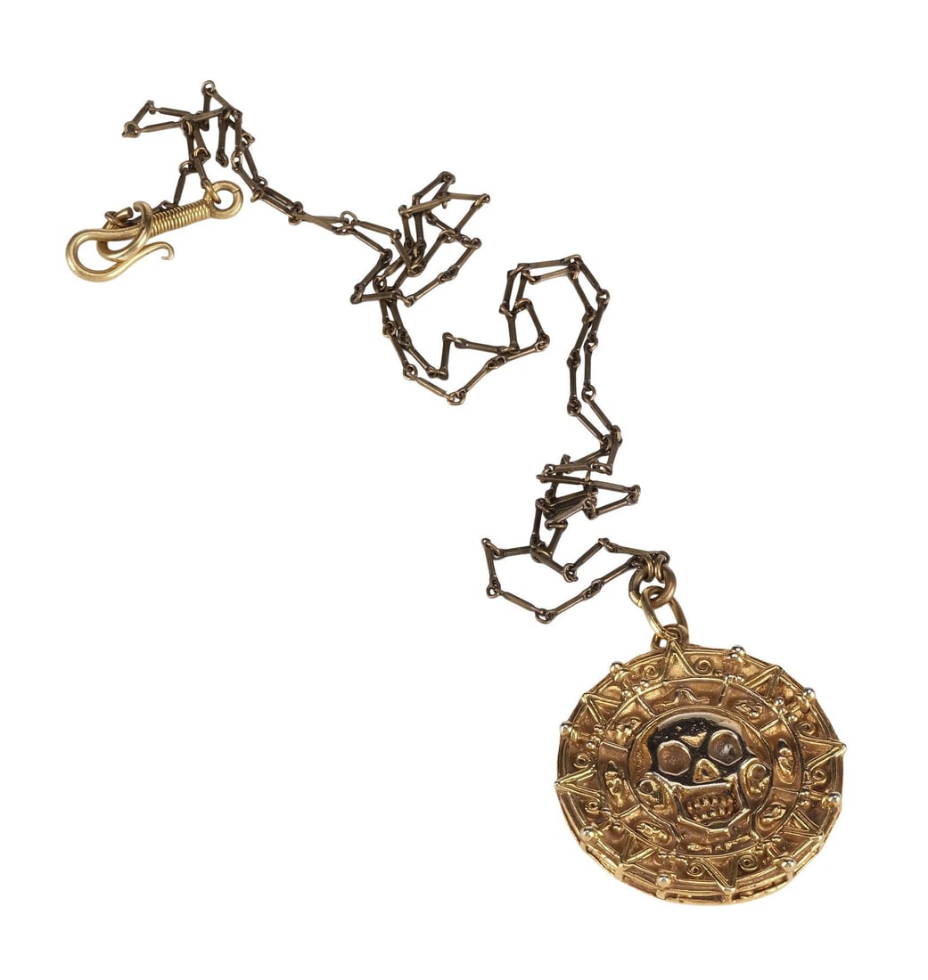 PIRATES OF THE CARIBBEAN: THE CURSE OF THE BLACK PEARL (2003) - Cursed Aztec Medallion Necklace: PIRATES OF THE CARIBBEAN: THE CURSE OF THE BLACK PEARL (2003) - Cursed Aztec Medallion Necklace - A cursed Aztec medallion necklace from Gore Verbinski's Pirates of the Caribbean: The Curse of the Bla