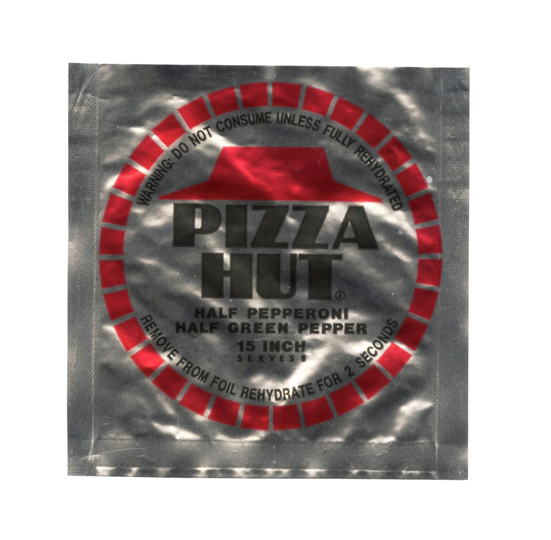 BACK TO THE FUTURE PART II (1989) - Production-Made McFly Family Dehydrated Pizza Hut Wrapper: BACK TO THE FUTURE PART II (1989) - Production-Made McFly Family Dehydrated Pizza Hut Wrapper - A dehydrated Pizza Hut wrapper from the production of Robert Zemeckis' Back to the Future Part II. In