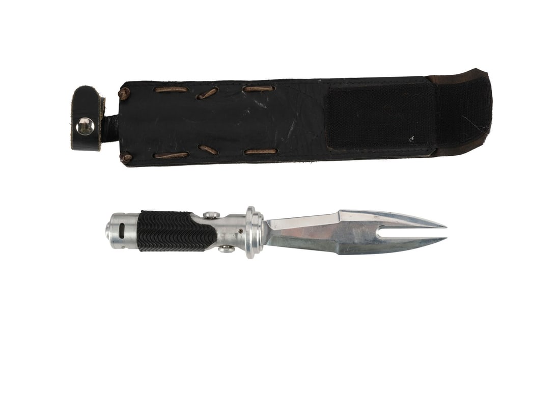 BLADE: TRINITY (2004) - Blade's (Wesley Snipes) Metal Knife and Sheath: BLADE: TRINITY (2004) - Blade's (Wesley Snipes) Metal Knife and Sheath - Blade's (Wesley Snipes) metal knife and sheath from David S. Goyer's Blade: Trinity. Blade carried his knife, which could detac