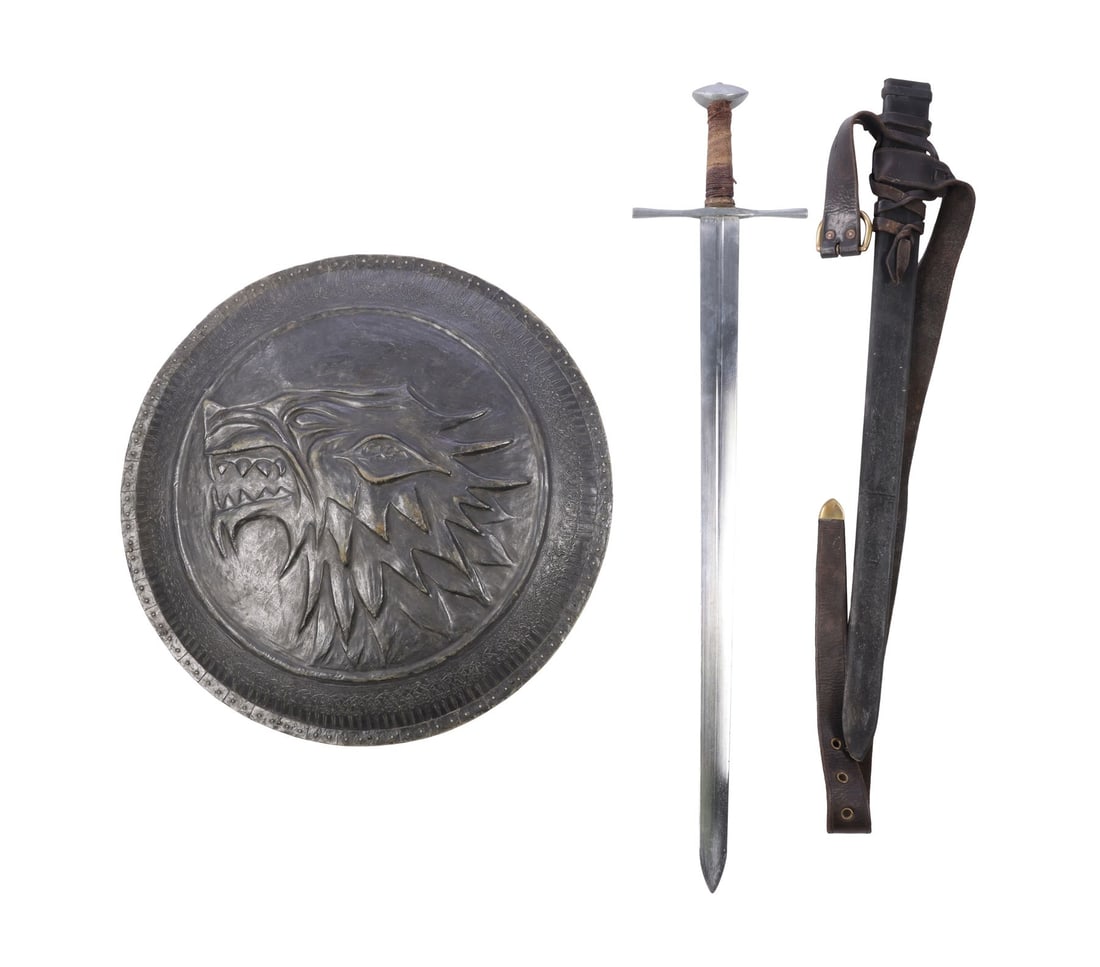 GAME OF THRONES (T.V. SERIES, 2011 - 2019) - Stark Shield and Sword: GAME OF THRONES (T.V. SERIES, 2011 - 2019) - Stark Shield and Sword - A House Stark shield and sword from the fantasy television series Game of Thrones. Soldiers fighting for House Stark carried