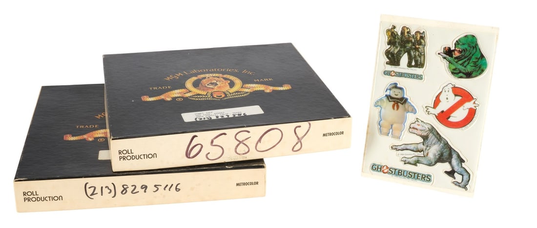 GHOSTBUSTERS (1984) - Set of 23 35mm Film Rolls and One Sticker Sheet: GHOSTBUSTERS (1984) - Set of 23 35mm Film Rolls and One Sticker Sheet - A set of 23 35mm film rolls and one sticker sheet from Ivan Reitman's Ghostbusters. Created in the photochemical era of visual