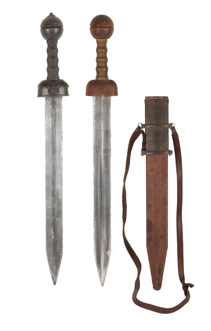 GLADIATOR (2000) - Hero Gladius and Stunt Officer Sword: GLADIATOR (2000) - Hero Gladius and Stunt Officer Sword - A hero metal gladius sword and scabbard, and a stunt officer's sword, from Ridley Scott's Academy Award-winning historical drama Gladiator.