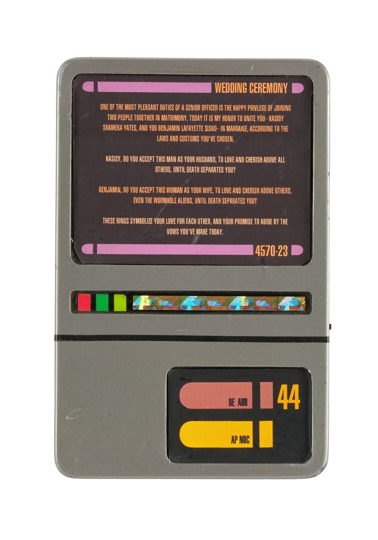 STAR TREK: THE NEXT GENERATION (T.V. SERIES, 1987-1994)/STAR TREK: DEEP SPACE NINE (T.V. SERIES,: STAR TREK: THE NEXT GENERATION (T.V. SERIES, 1987-1994)/STAR TREK: DEEP SPACE NINE (T.V. SERIES, 1993-1999) - Starfleet PADD with Sisko-Yates Wedding Screen - A Starfleet PADD from the series Star Tre