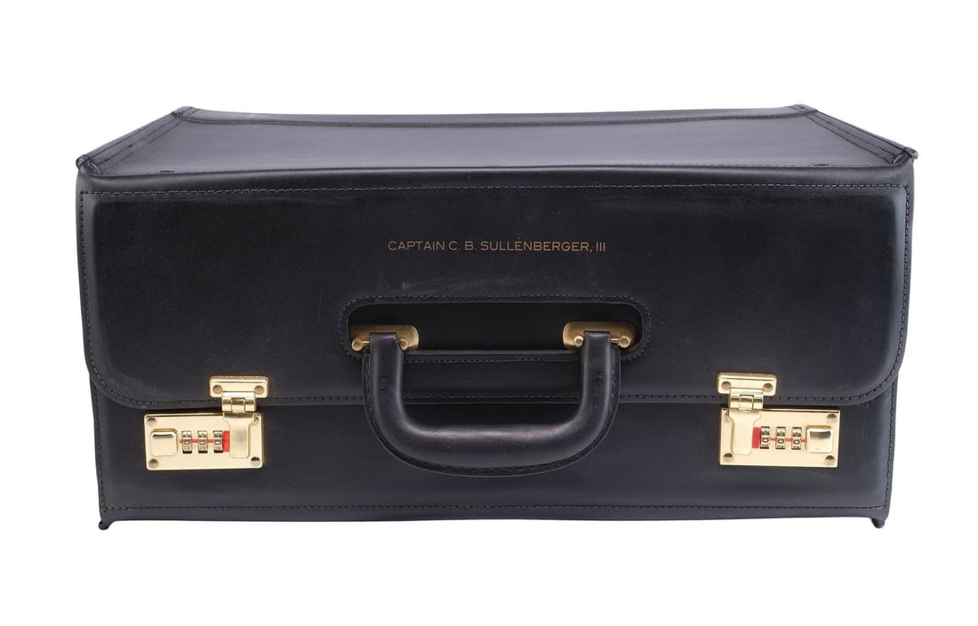 SULLY (2016) - Captain Chesley "Sully" Sullenberger's (Tom Hanks) Flight Bag with Collection of: SULLY (2016) - Captain Chesley "Sully" Sullenberger's (Tom Hanks) Flight Bag with Collection of Aviation Papers - Captain Chesley "Sully" Sullenberger's (Tom Hanks) flight bag with a collection of avi