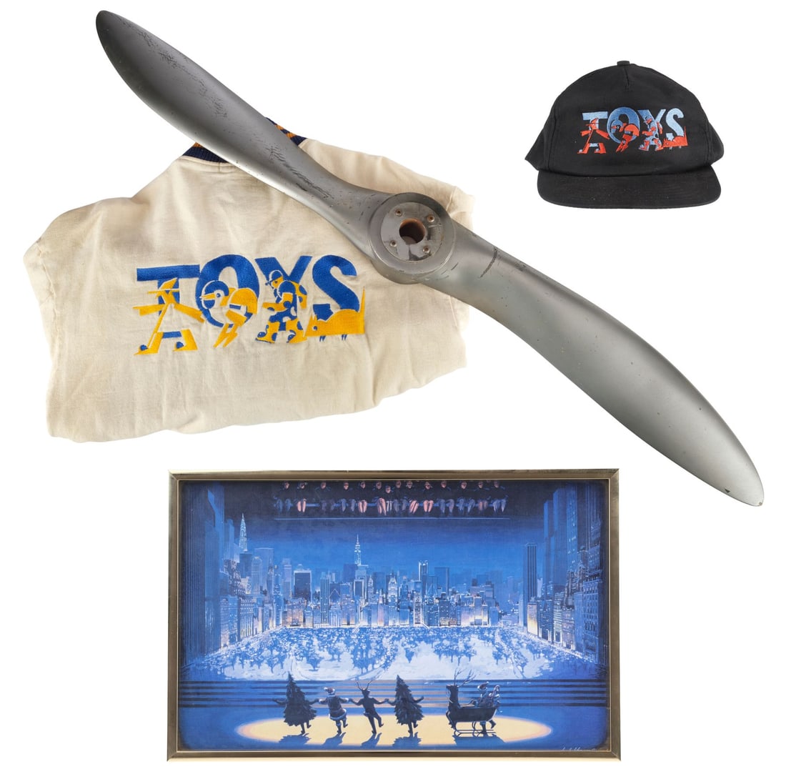 TOYS (1992) - Propeller Blade, Crew Jacket and Hat, and Production Artwork: TOYS (1992) - Propeller Blade, Crew Jacket and Hat, and Production Artwork - A propeller blade, crew jacket and hat, and production artwork from Barry Levison's Toys. During the Christmas pageant, San