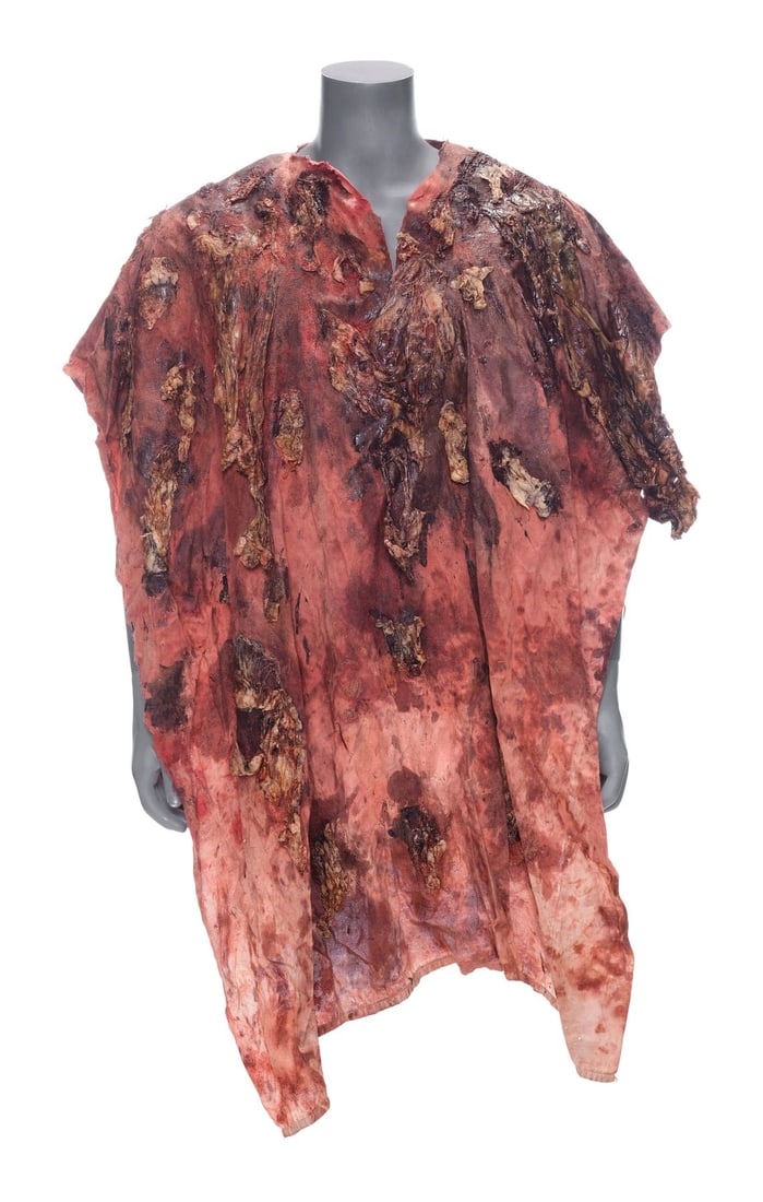 THE WALKING DEAD (T.V. SERIES, 2010 - 2022) - Carl Grimes' (Chandler Riggs) Bloodied Walker-Gut: THE WALKING DEAD (T.V. SERIES, 2010 - 2022) - Carl Grimes' (Chandler Riggs) Bloodied Walker-Gut Poncho - Carl Grimes' (Chandler Riggs) bloodied walker-gut poncho from AMC's The Walking Dead. Carl, fol