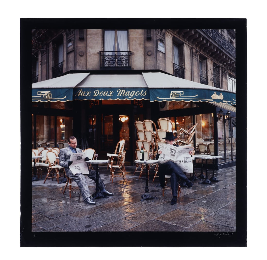 ELTON JOHN - Limited Edition Elton John and Bernie Taupin Aux Deux Magots C-Type Print by Terry: ELTON JOHN - Limited Edition Elton John and Bernie Taupin Aux Deux Magots C-Type Print by Terry O'Neill, 1980 - An archival C-type print depicting English singer Elton John outside Aux Deux Magots in