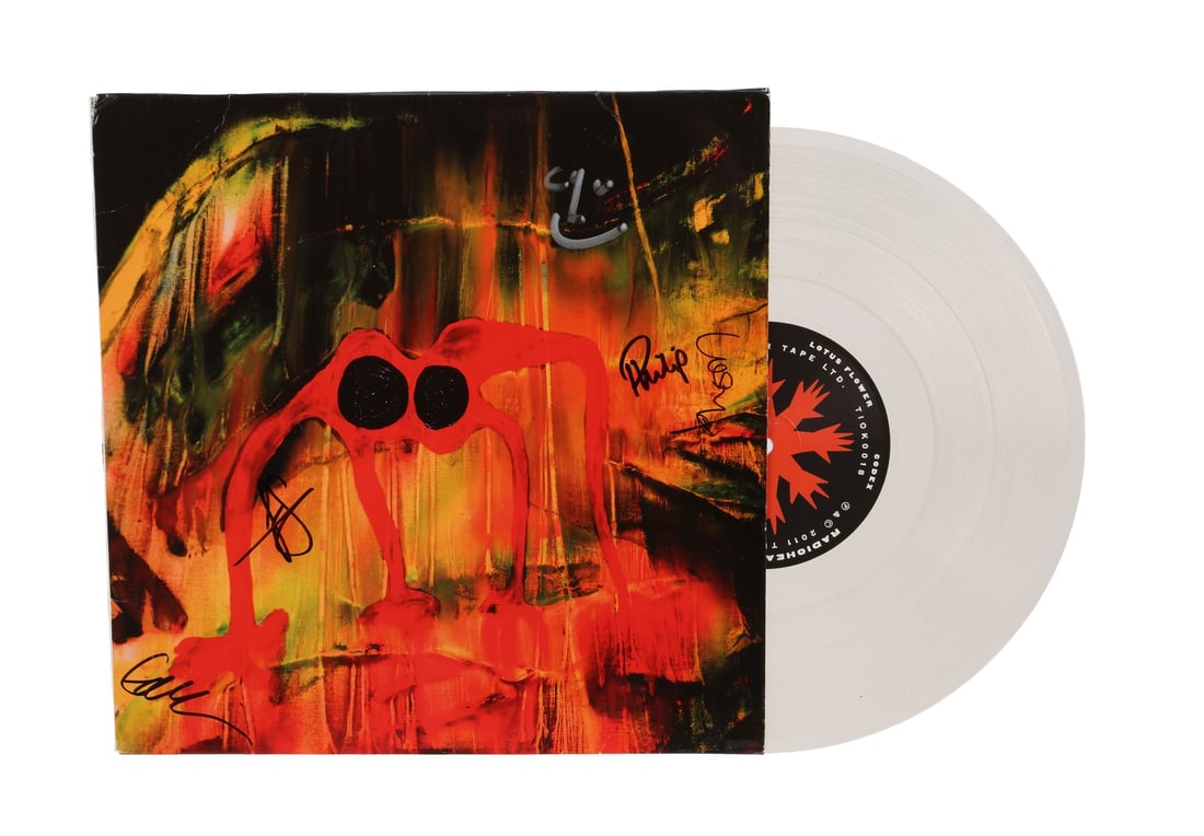 RADIOHEAD - Thom Yorke, Colin Greenwood, Jonny Greenwood, Ed O'Brien, Philip Selway-Autographed The: RADIOHEAD - Thom Yorke, Colin Greenwood, Jonny Greenwood, Ed O'Brien, Philip Selway-Autographed The King of Limbs Vinyl and Newspaper Page - A vinyl pressing of Radiohead's eighth studio album The Kin