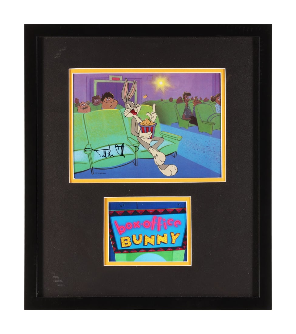 BOX-OFFICE BUNNY (SHORT 1990) - Framed Bugs Bunny Publicity Cel from "Bugs Bunny at the Movies" on: BOX-OFFICE BUNNY (SHORT 1990) - Framed Bugs Bunny Publicity Cel from "Bugs Bunny at the Movies" on Printed Presentation Background Signed by Darryl Van Citters - Here is Bugs Bunny settled into a cine