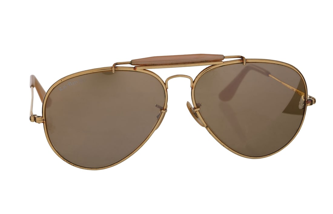 GEORGE MICHAEL - George Michael's Owned and Stage-Worn Faith Tour Ray-Ban 50 Sunglasses, 1988: GEORGE MICHAEL - George Michael's Owned and Stage-Worn Faith Tour Ray-Ban 50 Sunglasses, 1988 A pair of Ray-Ban 50 sunglasses owned and worn by George Michael during his Faith World Tour. Following th