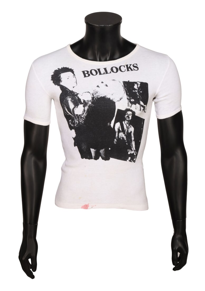 SEX PISTOLS - Steve Jones-Owned “Sid and Nancy Bollocks?? T-Shirt: SEX PISTOLS - Steve Jones-Owned “Sid and Nancy Bollocks” T-Shirt A Sex Pistols "Sid and Nancy Bollocks" T-shirt owned by the Pistols' guitarist Steve Jones in the late 1970s. The T-shirt origi
