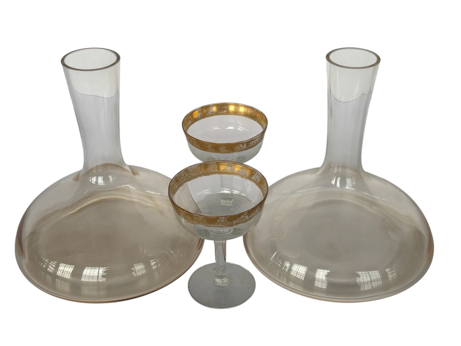 Pair of Contemporary Ship Decanters and More: Matching pair of ship decanters in soft amber tone glass also included a pair of antique champagne coupes with gold rim similar to Tiffin Melrose.
