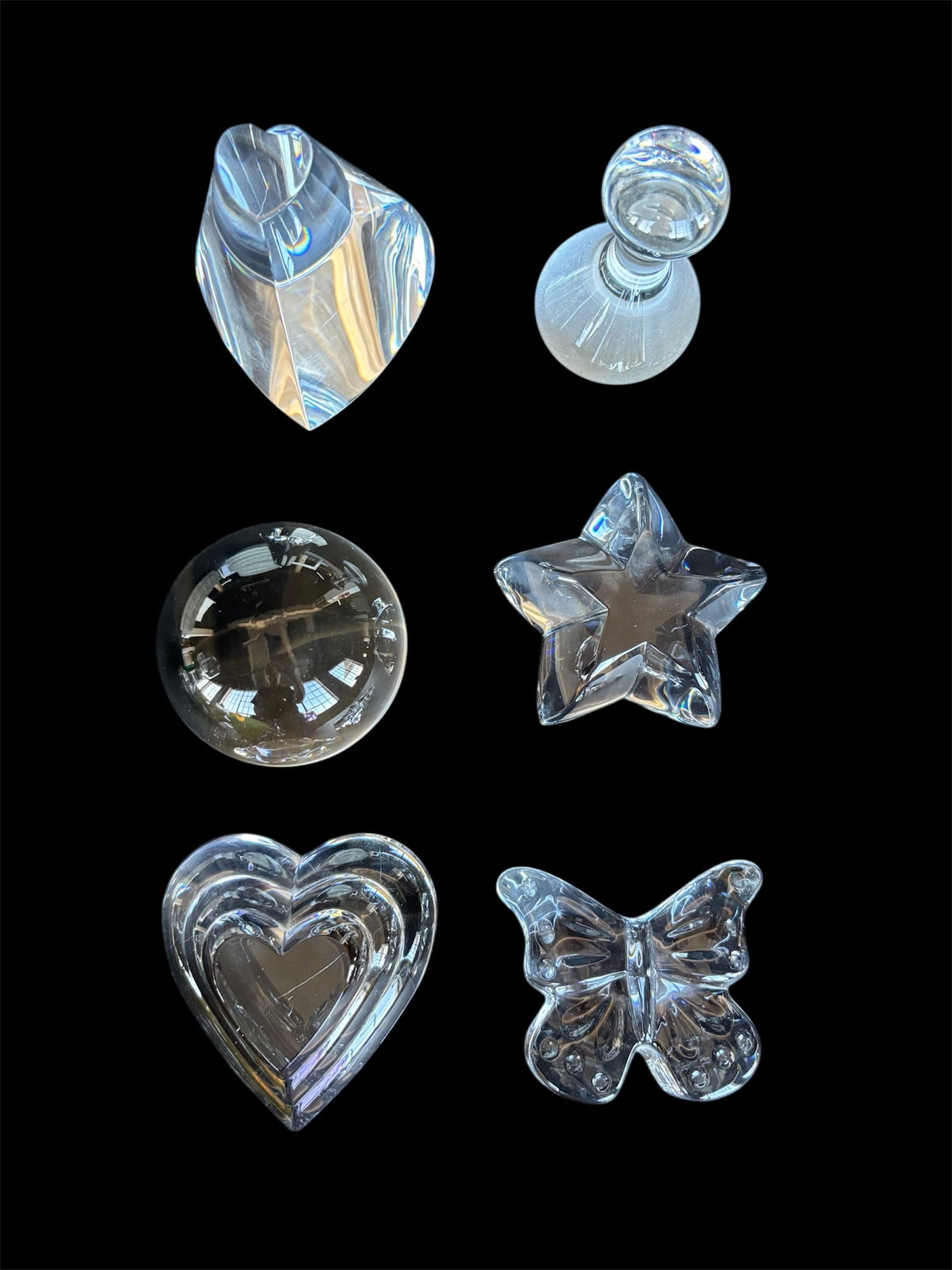 Collection of Glass Paperweights: Including 2 heart designs, sphere, chess piece, butterfly and star shaped. Clear glass contemporary design.