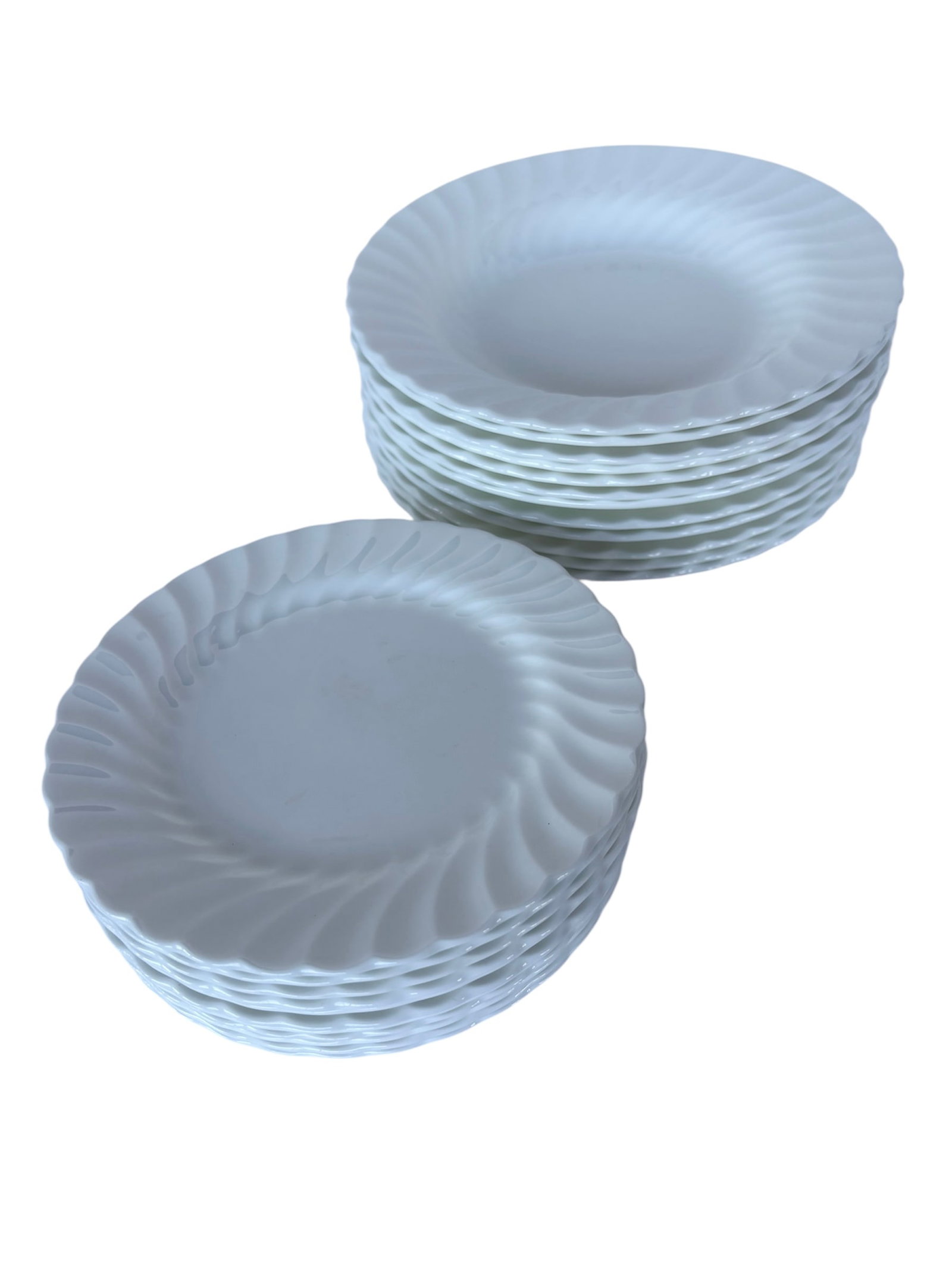 Wedgwood Bone China Set: Made in England, White Wedgwood bone china with swirl rim design. Salad bowls (12) 8/5" and Bread and Butter plates (12) 6.75"
