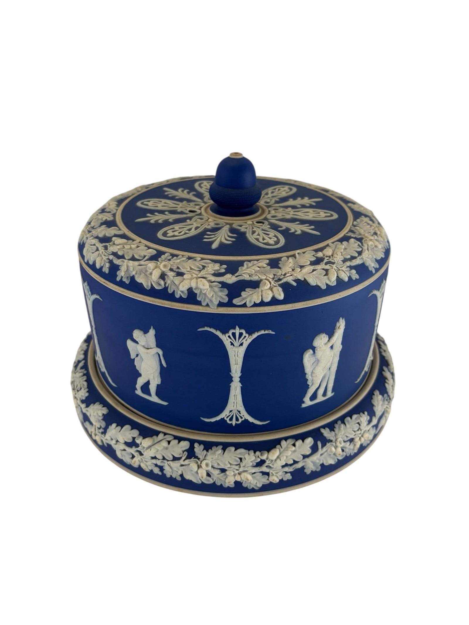 Wedgwood Jasperware Stilton Cheese Dome: Featuring Wedgwood Blue with white relief decorations in a neoclassical style including figures and foliage like oak leaves and acorns. Designed to keep cheese, particularly Stilton, fresh and present