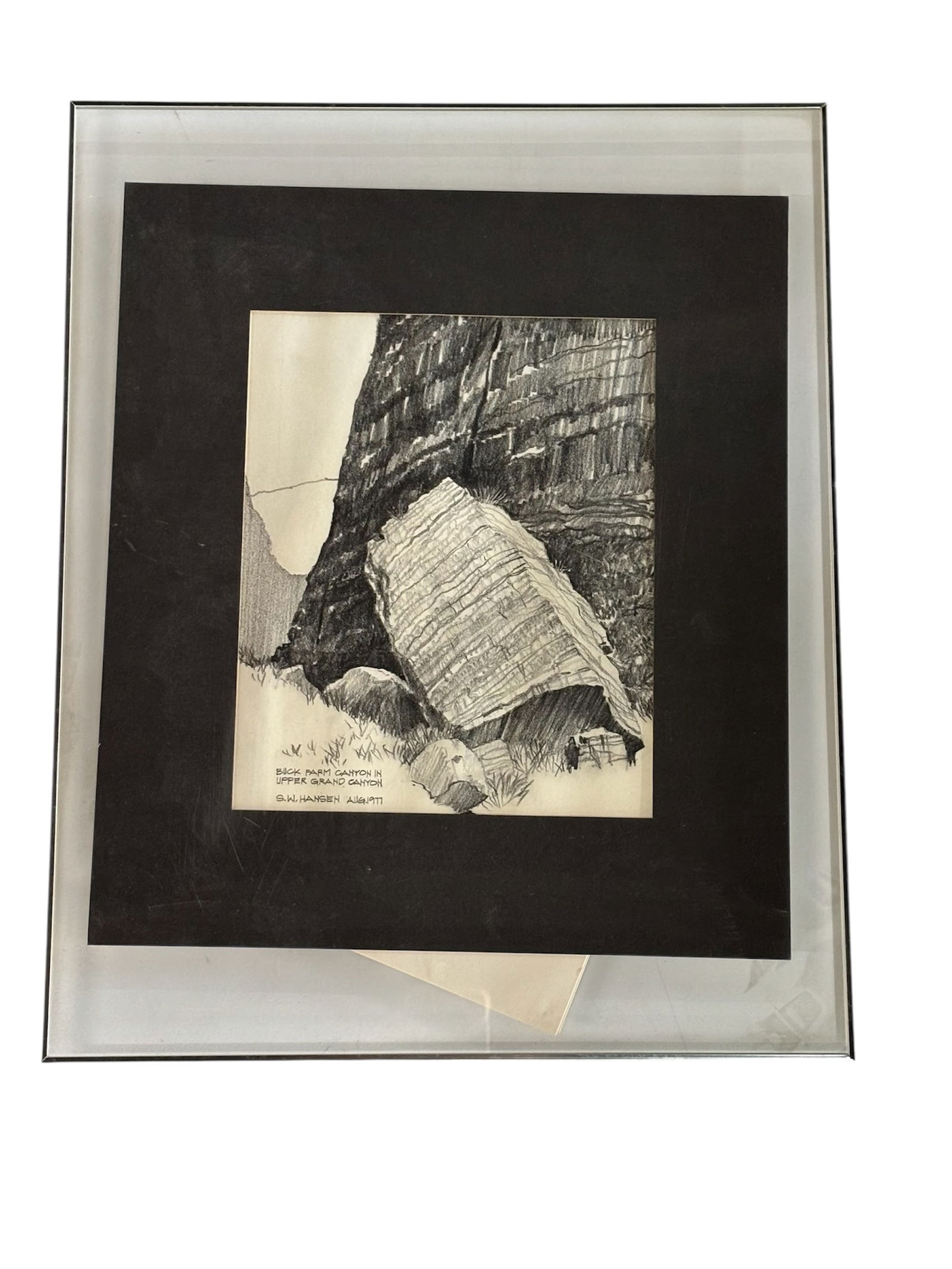 "Buck Farm Canyon" by S.W. Hansen: Circa 1977. Drawing by S. W. Hansen of Buck Farm Canyon, framed in modern lucite frame (drawing is loose under lucite needs reset). Black matted border and silver rim on frame.