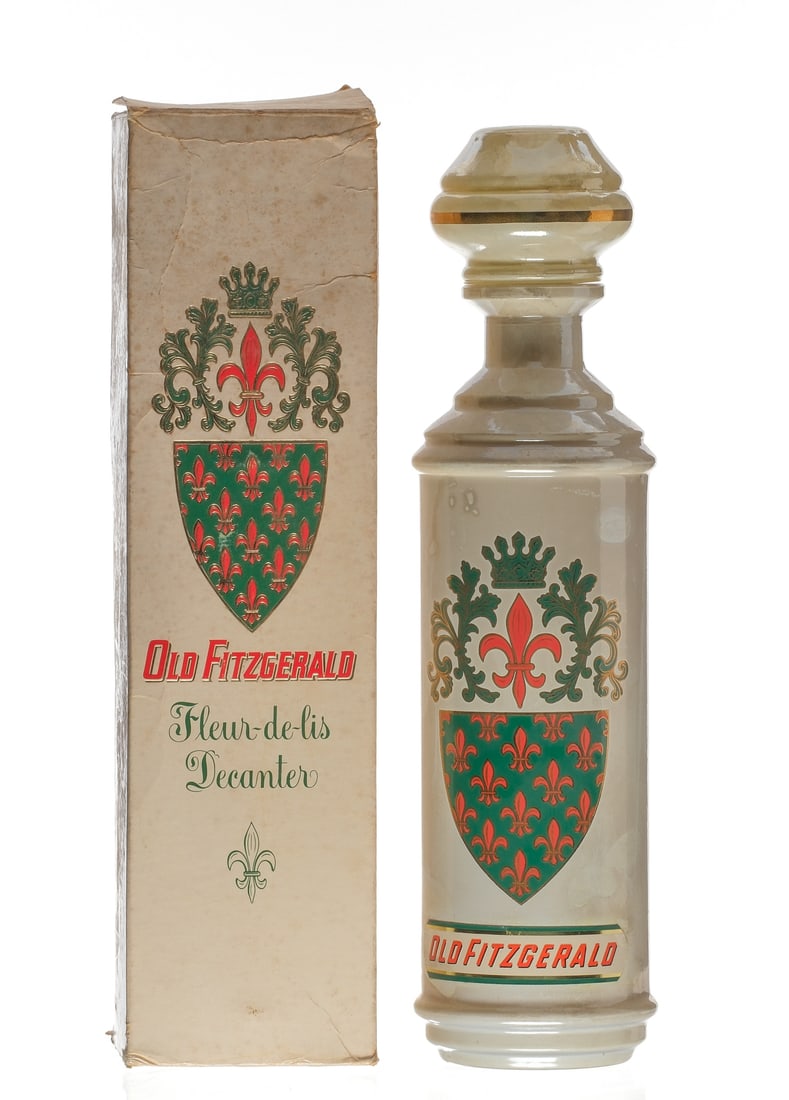 1962 Old Fitzgerald Original Sour Mash Bourbon: Description Stitzel Weller Distillery. Distilled in fall of 1956. Bottled fall of 1962. 100 Proof. Original box exhibits wear. Fleur-de-lis decorated porcelain decanter with staining. Cork maintains s