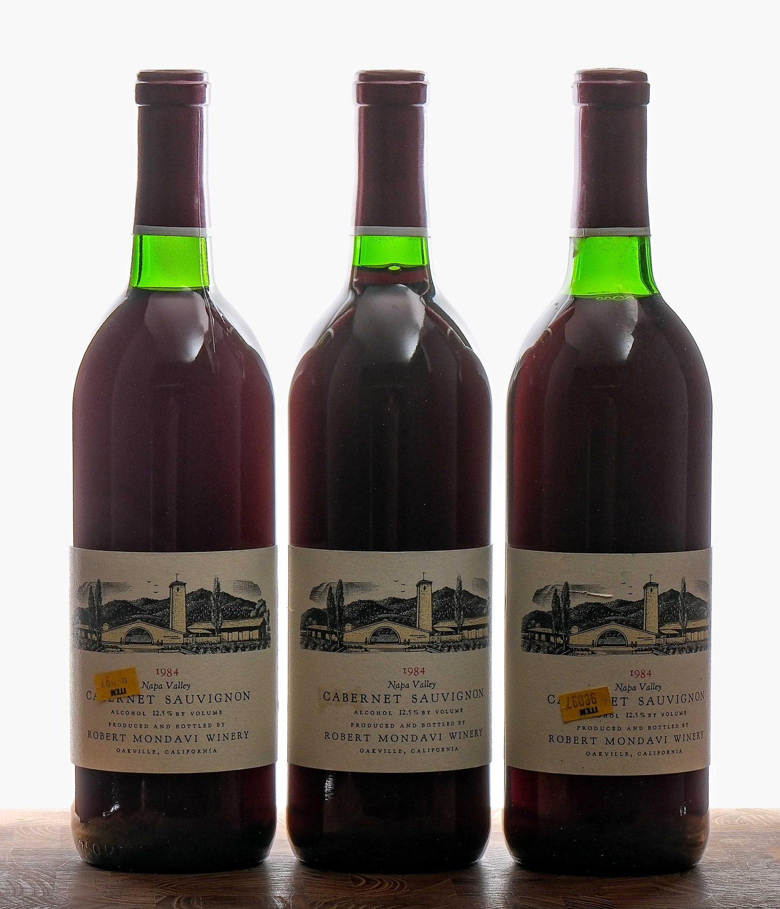Robert Mondavi Cabernet Sauvignon 1984 Group (3): Group of 3 bottles with a 1984 vintage. Fill level is top shoulder on two bottles and base neck on the third (some seepage evident on one of the top shoulders and on the base neck bottle). 12.5% ALC/V