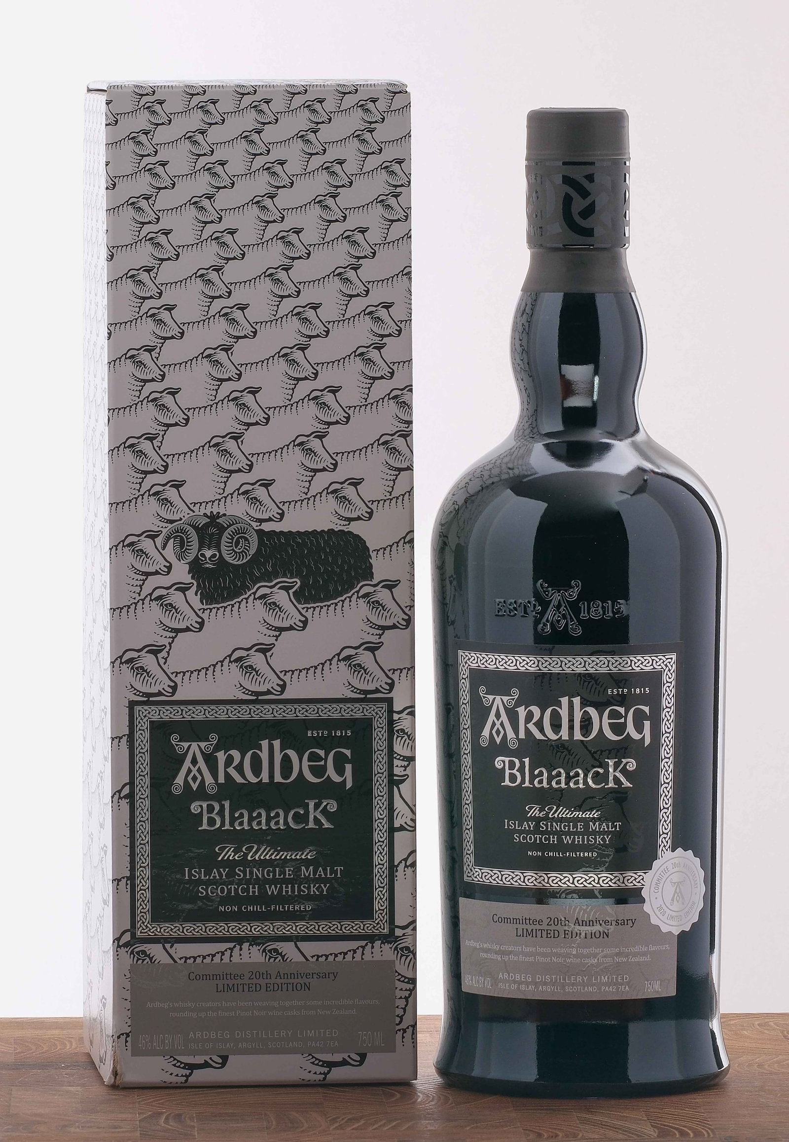 Ardbeg "Blaaack" Islay Single Malt Scotch: Committee 20th Anniversary 2020 Limited Edition. Matured in New Zealand Pinot Noir casks. 46% ALC/VOL. Original cardboard box largely excellent (flap beneath lid exhibits some creasing). Foils and lab