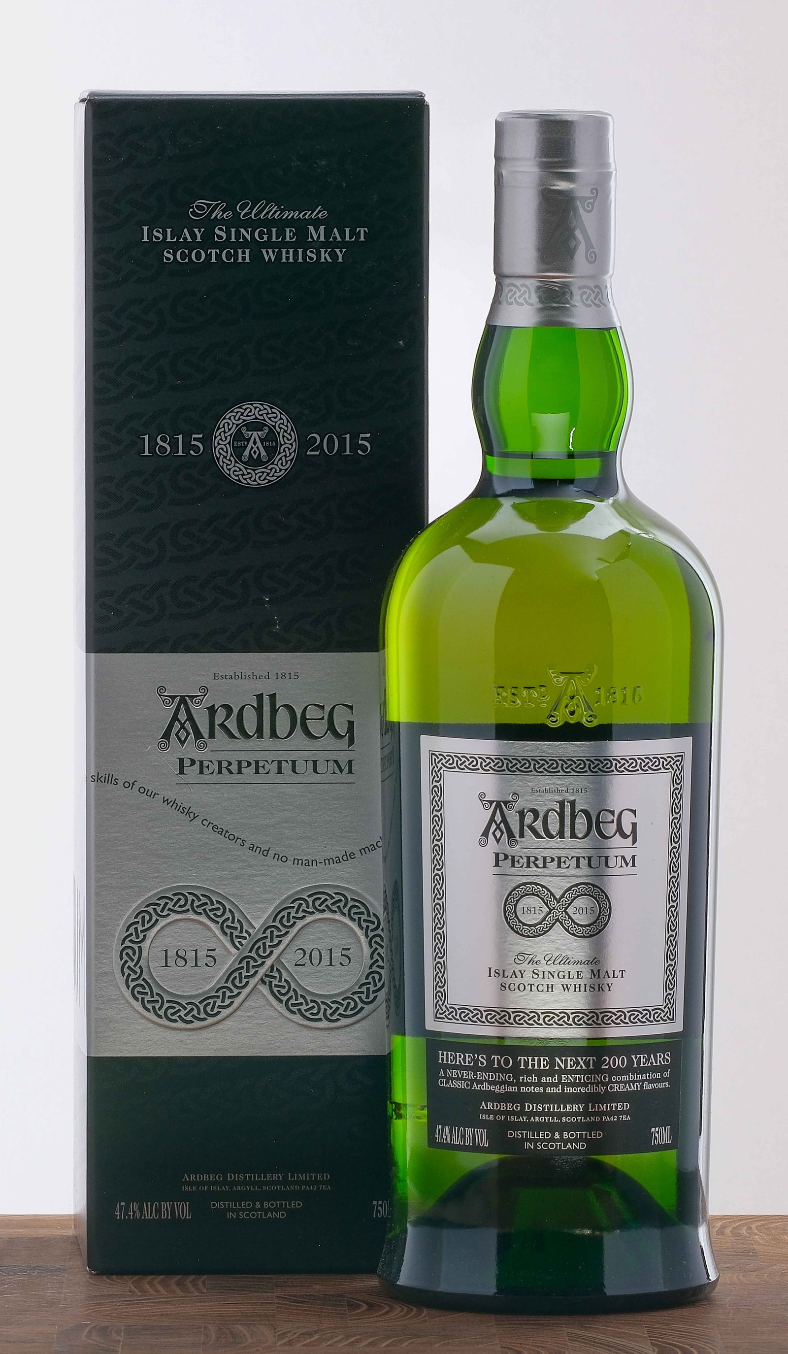 Ardbeg "Perpetuum" Islay Single Malt Scotch 2015: Celebrating 200 years of Ardbeg. 47.4% ALC/VOL. Original cardboard box largely excellent (there are some minor instances of shelf wear in the form of scuffs and dings throughout). Foils and labels exc