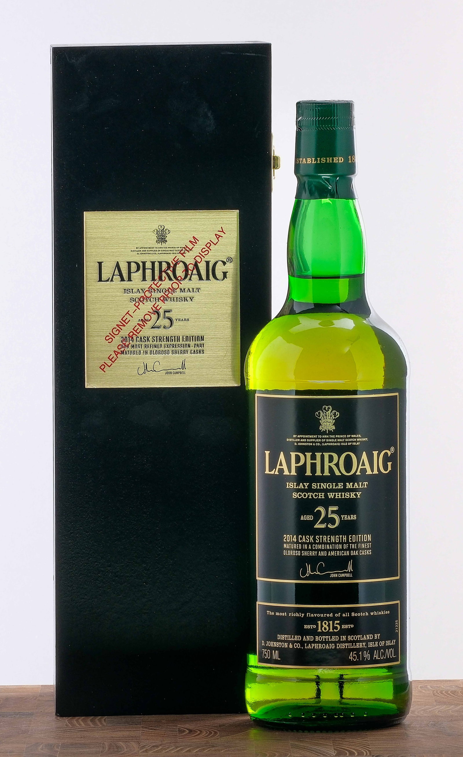 Laphroaig 25 Year Islay Single Malt Cask Strength Scotch: 2014 Cask Strength Edition. Partly matured in Oloroso Sherry casks. 45.1% ALC/VOL. Original wooden presentation box largely excellent (there are some minor instances of shelf wear and a UPC sticker ha