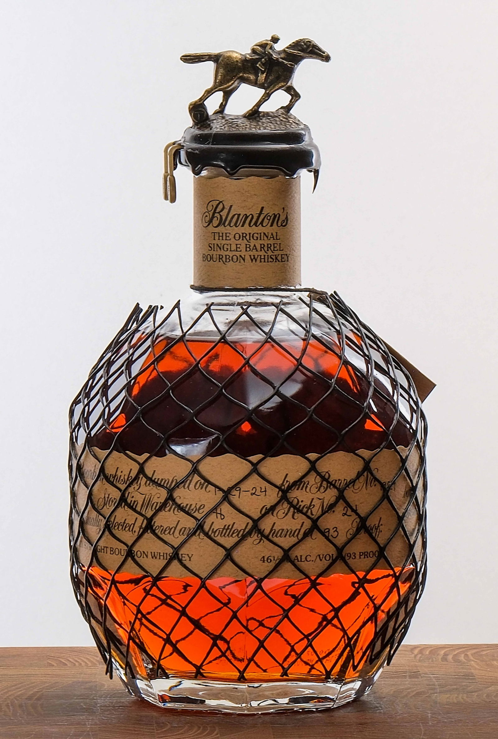 Blanton's Single Barrel Bourbon 2024: Dumped on 1-29-24 from Barrel No. 1929. Stored in Warehouse H on Rick No. 24. Registered Bottle No. 112. 46.5% ALC/VOL (93 Proof). Wax seal intact. Hang tag intact. Labels exhibit some creasing and do