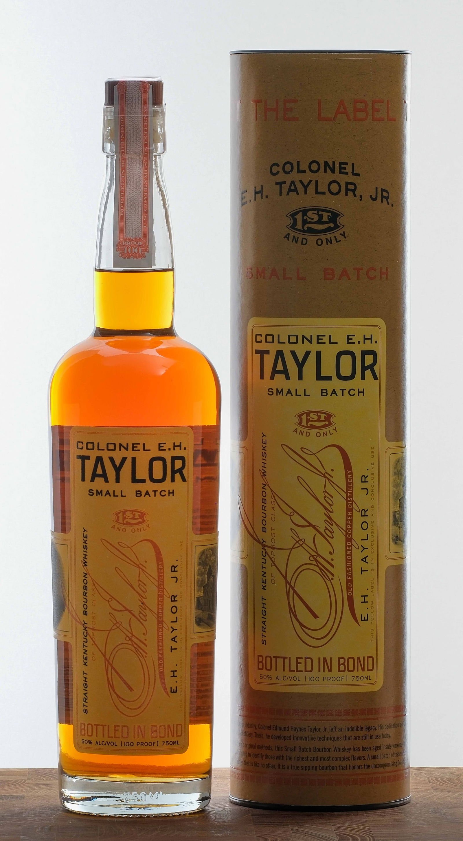 E.H. Taylor Small Batch Straight Kentucky Bourbon: 50% ALC/VOL (100 Proof). Original cardboard tube excellent. Plastic seal on bottle intact. Labels excellent. 750ml. Old Fashioned Copper Distillery.