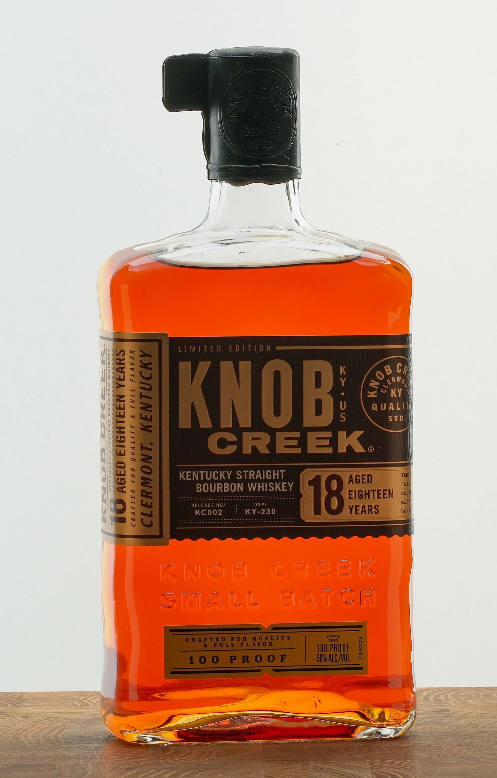 Knob Creek 18 Year Small Batch Bourbon: Limited Edition. Release No. KC002. DSP KY-230. 50% ALC/VOL (100 Proof). Wax seal intact. Hang tag intact. Labels excellent. 750ml. James B Beam Distilling Company.