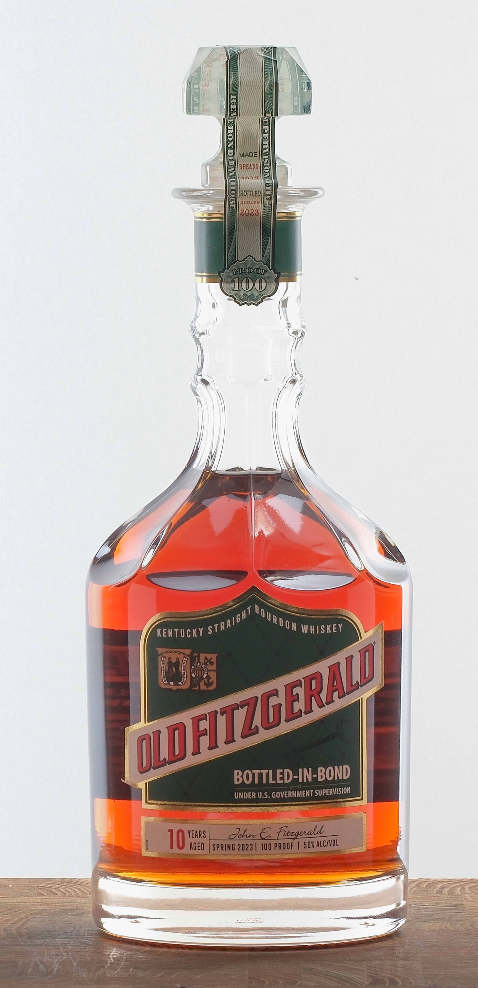 Old Fitzgerald 10 Year Kentucky Bourbon 2023: Made Spring 2013. Bottled Spring 2023. 50% ALC/VOL (100 Proof). Seals intact. Labels largely excellent (lower left corner of the Old Fitzgerald logo is lifting and experiencing dog-earing). 750ml. Old