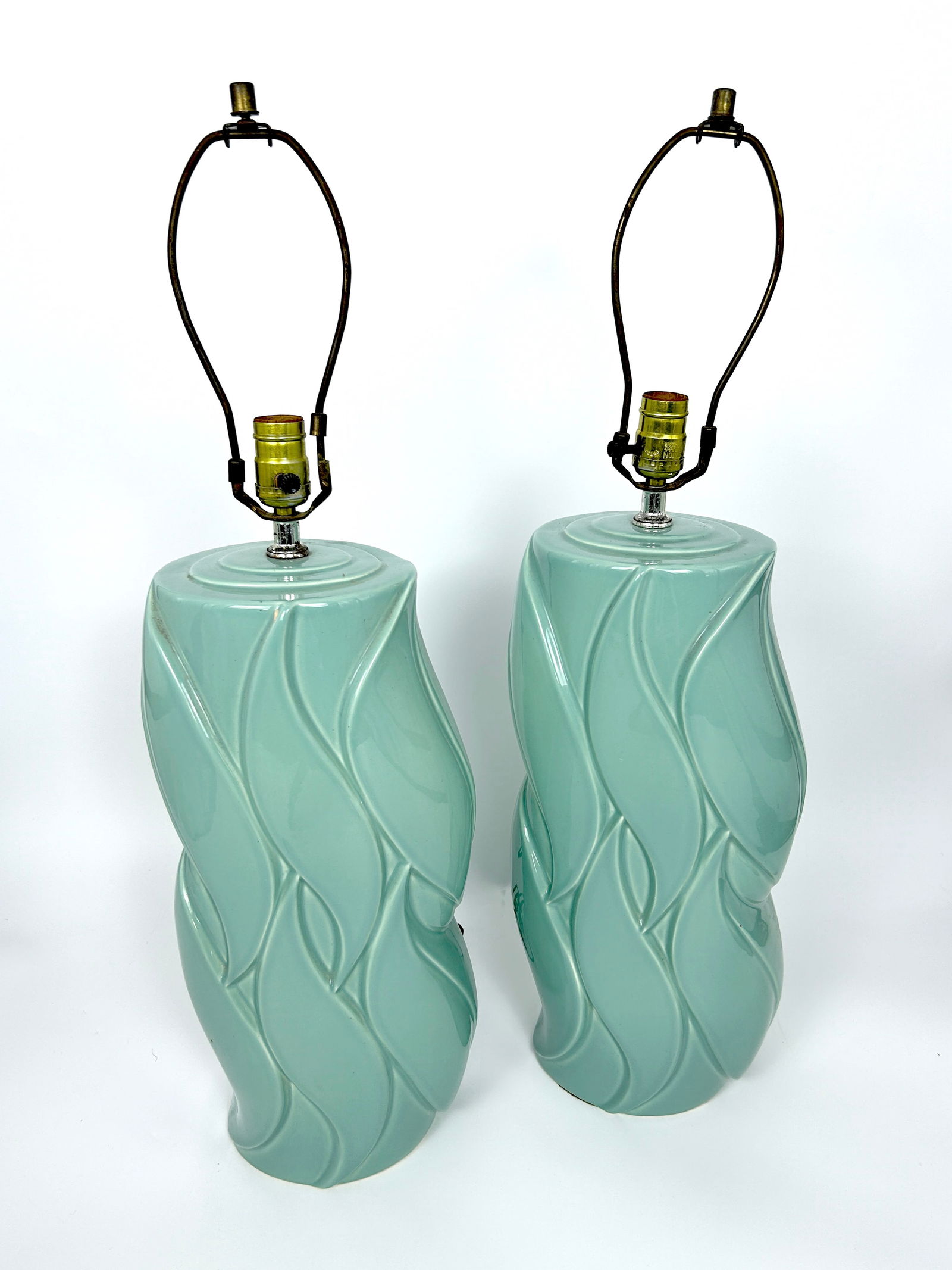 Pair Retro Signed Aqua Ceramic Harris Lamps: Pair Retro Signed Aqua Ceramic Harris Lamps DIMENSIONS: with harps 31 H X 9 W X 9 DEPTH in INCHES The live auction begins at 11 AM EST Sunday, March 17th. Full condition reports are available before t