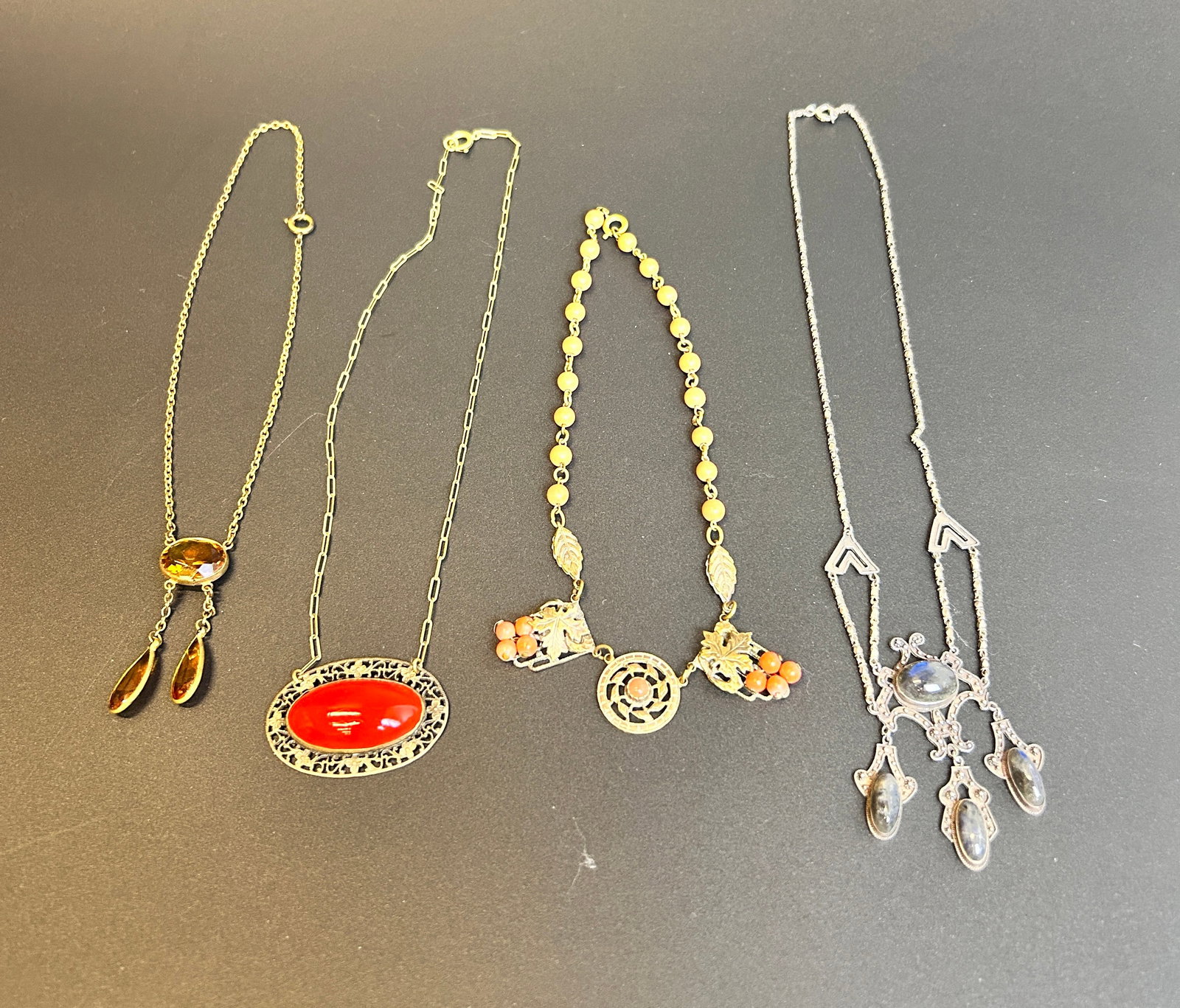 (4) Antique Necklaces with glass and stone details: (4) Antique Necklaces with glass and stone details each drop approx. 7 to 9.25 inches CONDITION: Good Join us online for Long Lake Art and Antique's Spring Sale, June 1st, 2025