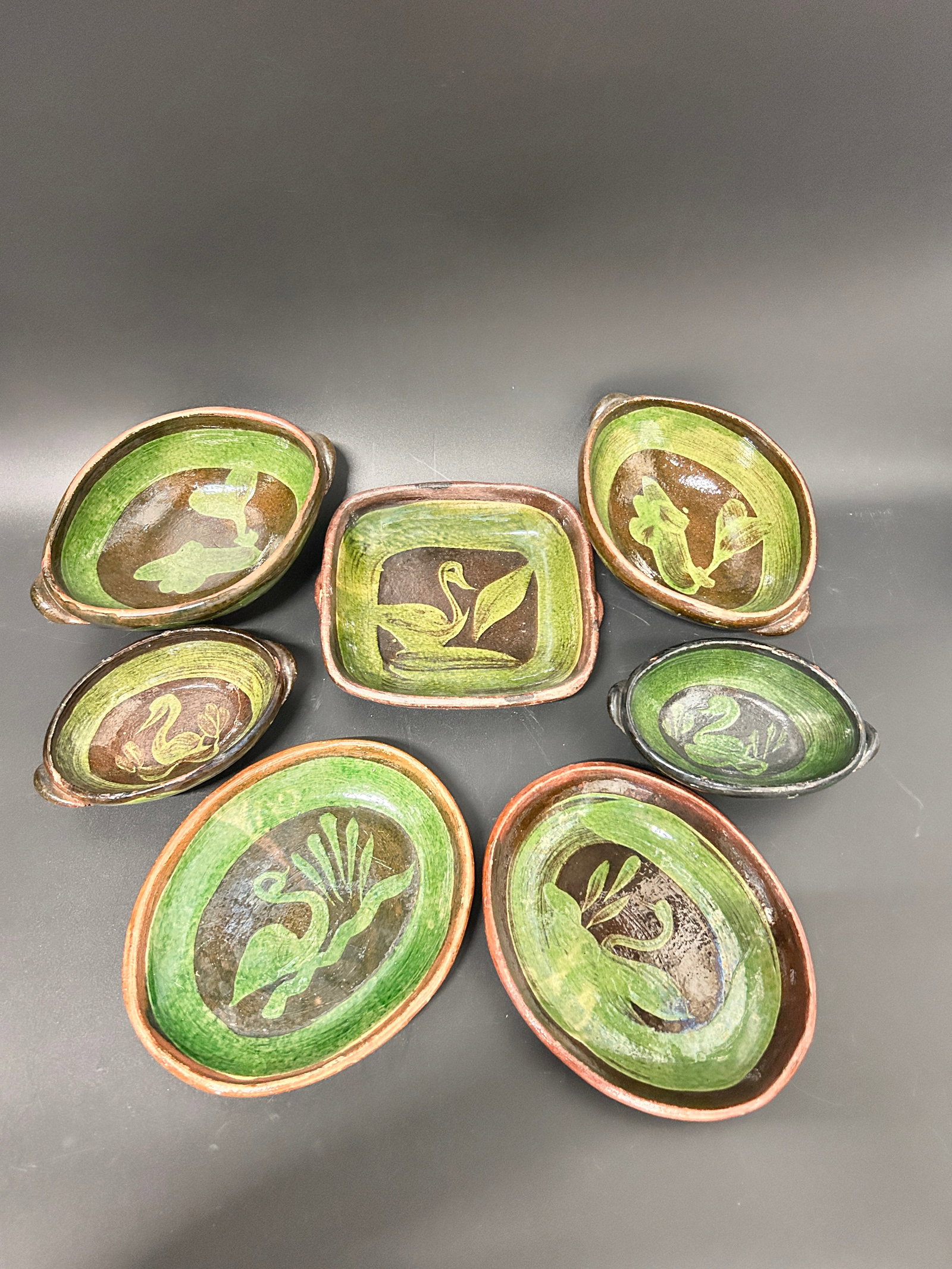 (7) Vintage Mexican Patamban Michoacan Swan Green Glaze Pottery: (7) Vintage Mexican Patamban Michoacan Swan Green Glaze Pottery 4 bowls, 3 serving plates dimension: length/d 6 to 8 inches Condition: Good. Join us online for Long Lake Art and Antiques Spring