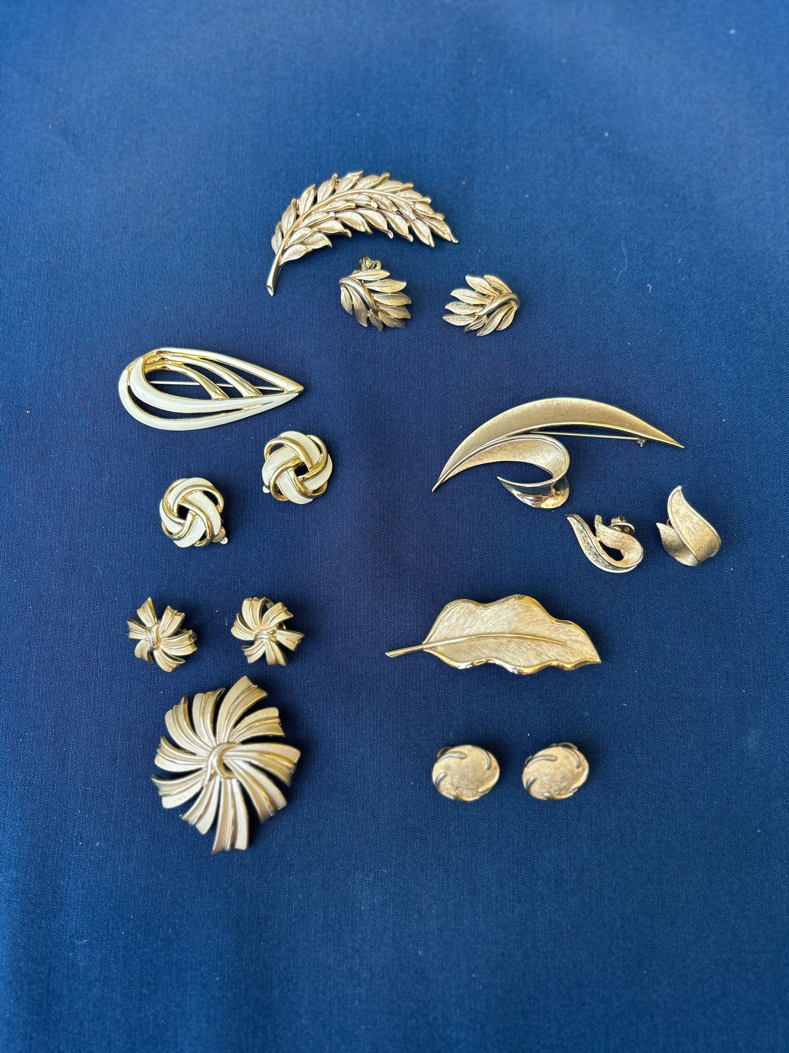 5 sets Vintage Crown Trifari gold-tone Brooches & Earrings:  5 sets Vintage Crown Trifari gold-tone Brooches & Earrings Condition: Good all signed Crown Trifari Join us online for Long Lake Art and Antiques Spring Sale, June 1st 11 AM EST