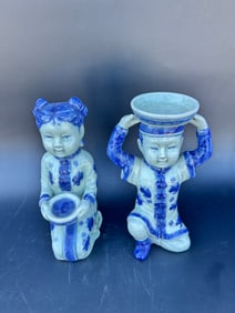 Pair modern Chinese seated figures in shades of blue