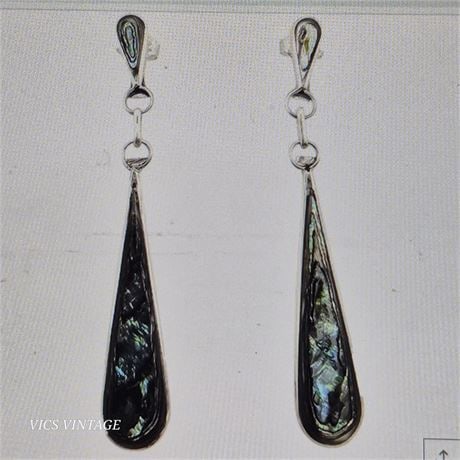 Alfred Gasper Navajo Sterling and Abalone Earrings: Handmade earrings by Navajo artisan Alfred Gasper featuring abalone inlays set in sterling silver. The earrings are "A. Gasper" on the back and have a sterling silver finish. They measure