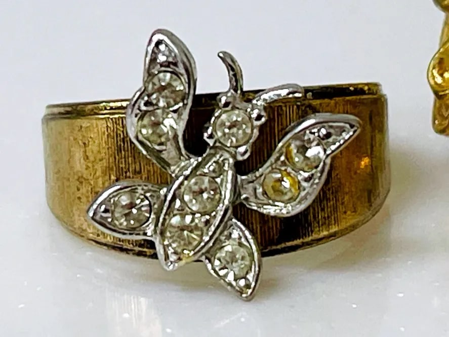 18K HGE Butterfly Cocktail Ring: Gold Ring featuring a butterfly accent band cocktail style, marked 18K HGE. Scuffs have been toned to luster====================================================