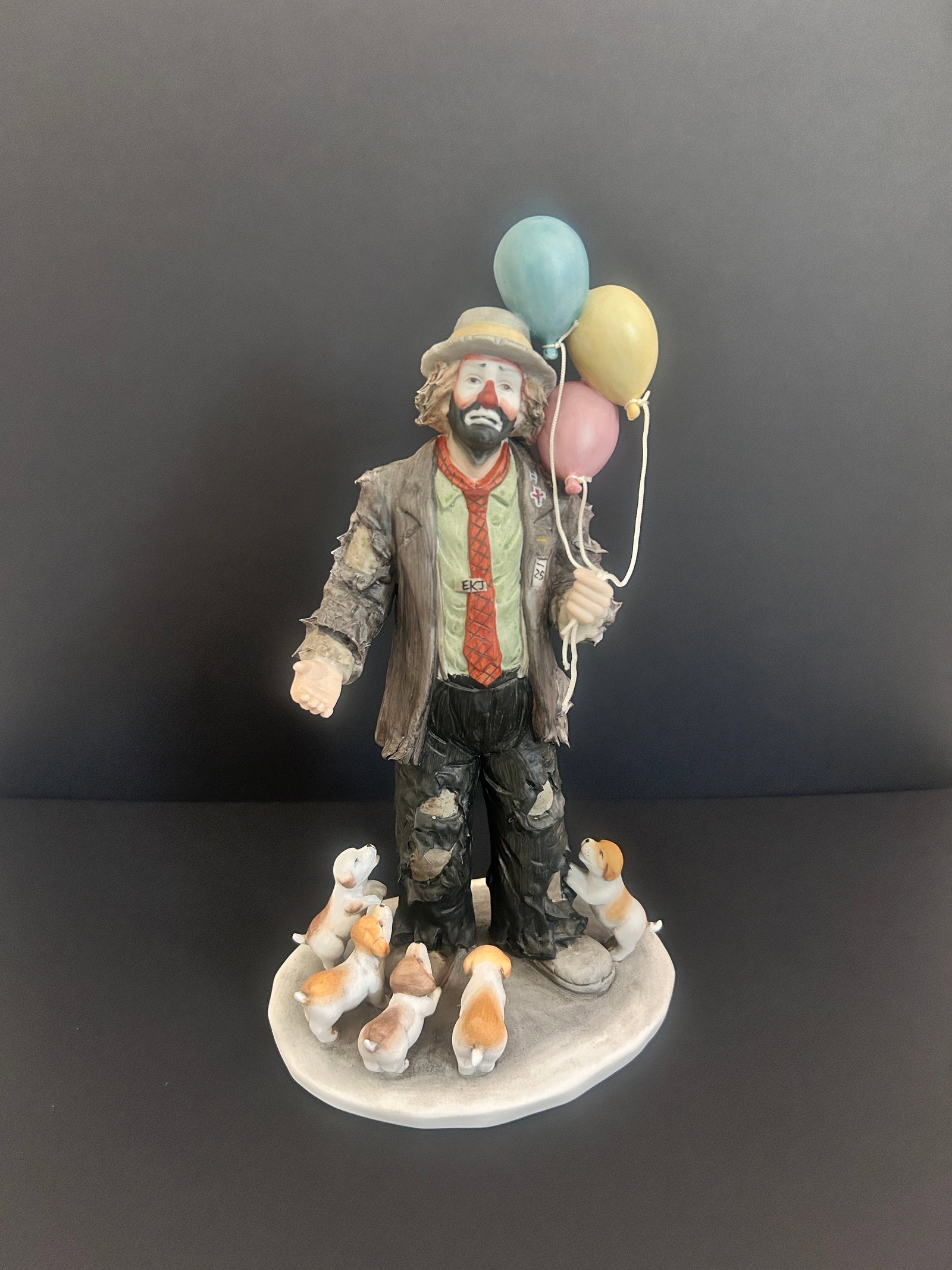Hand-signed Emmett Kelly Jr. Collection "My Favorite Things" Clown w/balloons & puppies: Flambro Imports Emmett Kelly Jr. Collection "My Favorite Things" Clown w/balloons & puppiessigned Emmett Kelly 1987 Numbered 4962 of 9500. 1987 Measures in inches 11 H x 6.5 W x 5.75.