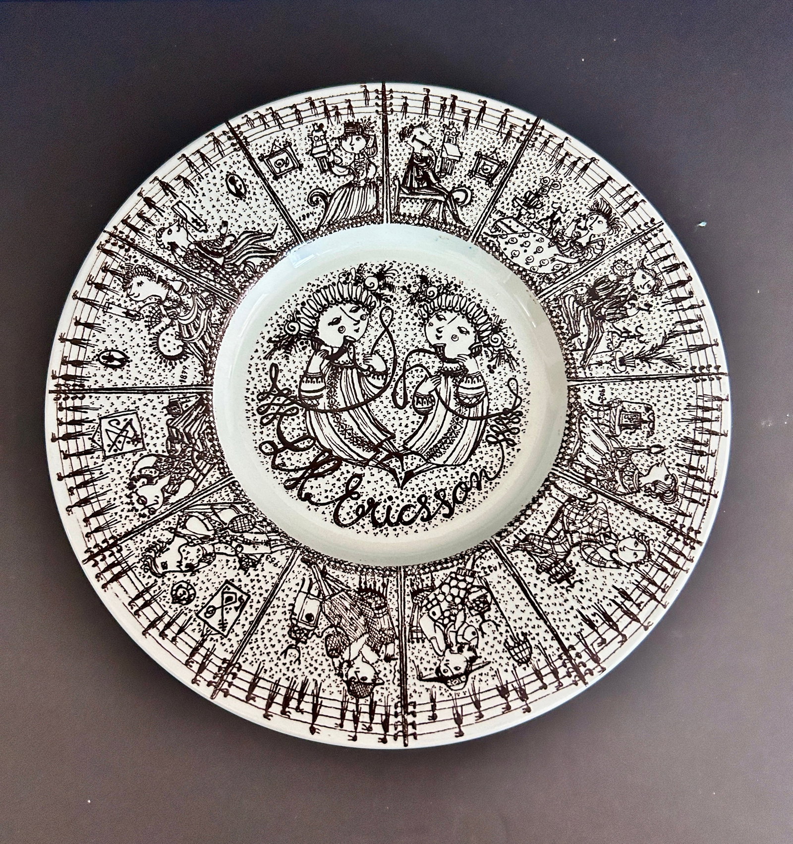 MCM Bjorn Wiimblad Nymolle Art Faience plate: Vintage Danish ceramic ad plate designed by Bjorn Wiinblad for Nymole produced for the phone company L.M. Ericsson featuring people on the phone. Dimension is 8.75 inches.