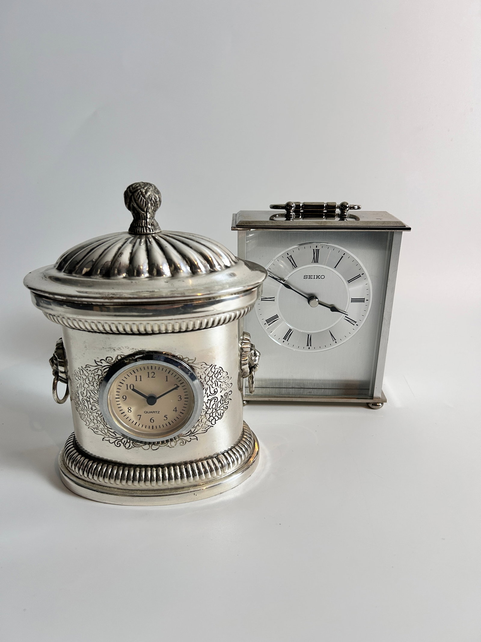 2 Small Mantle Clocks Seiko Chrome finish: 2 Small Mantle/Carriage Clocks one Seiko Chrome finish measures 6 x 5 x 2 inches, other measures 7.25 x 5.75 x 4 inches battery operated.