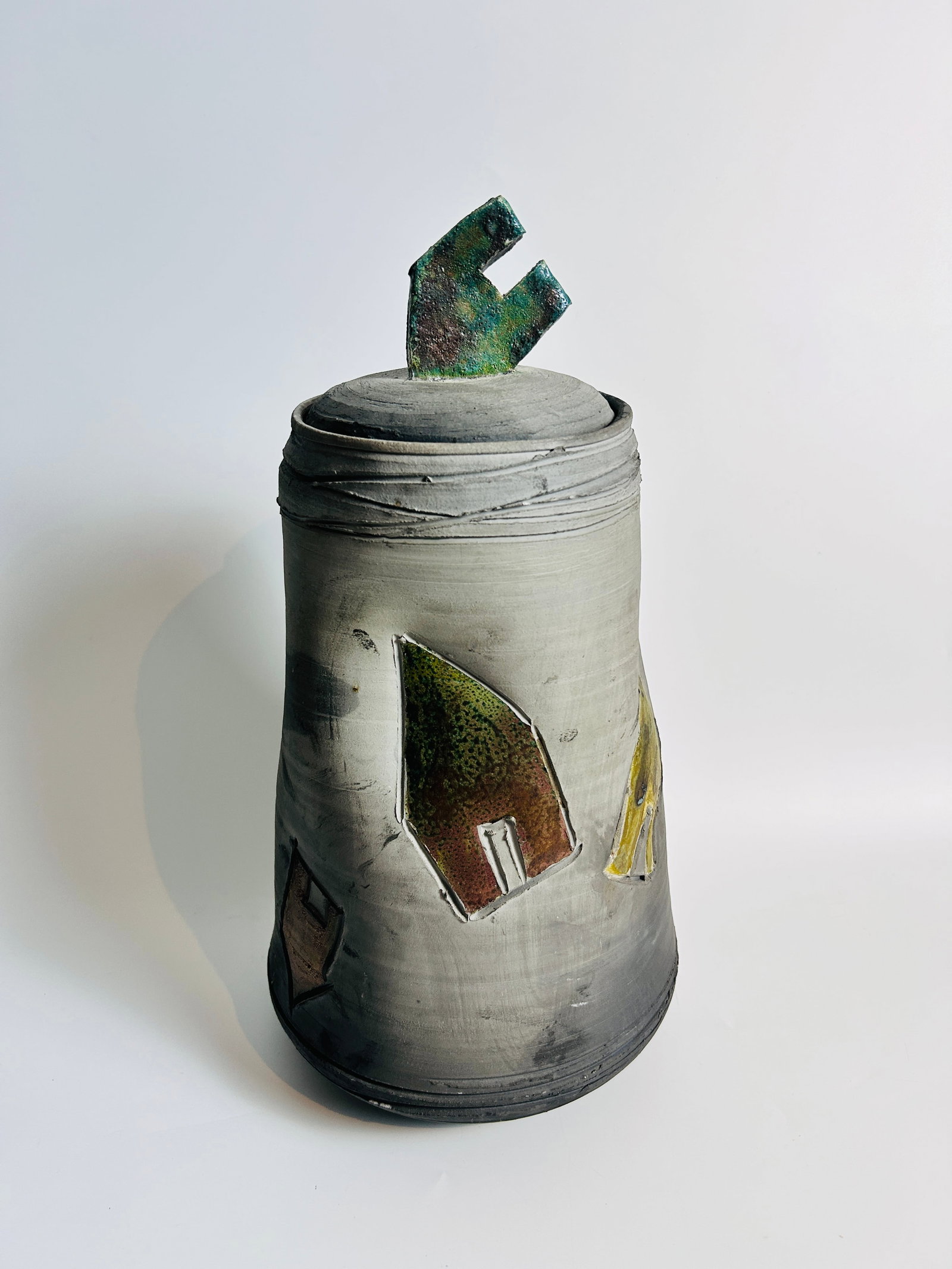 Large hand-formed Signed Raku pot with lid "Sandy Lentz": Large hand-formed Signed Raku pot with lid "Sandy Lentz" measures 16.75 H x 9 wide in inches.
