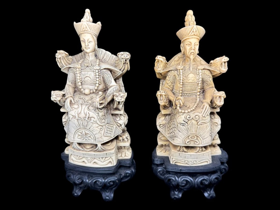 Vintage Carved Resin Chinese Emperor and Empress Statues: These are constructed of carved resin, and sit atop a fixed black resin base. There is age related wear. No splits, cracks, broken damage, color is commensurate with age and vintage. These are